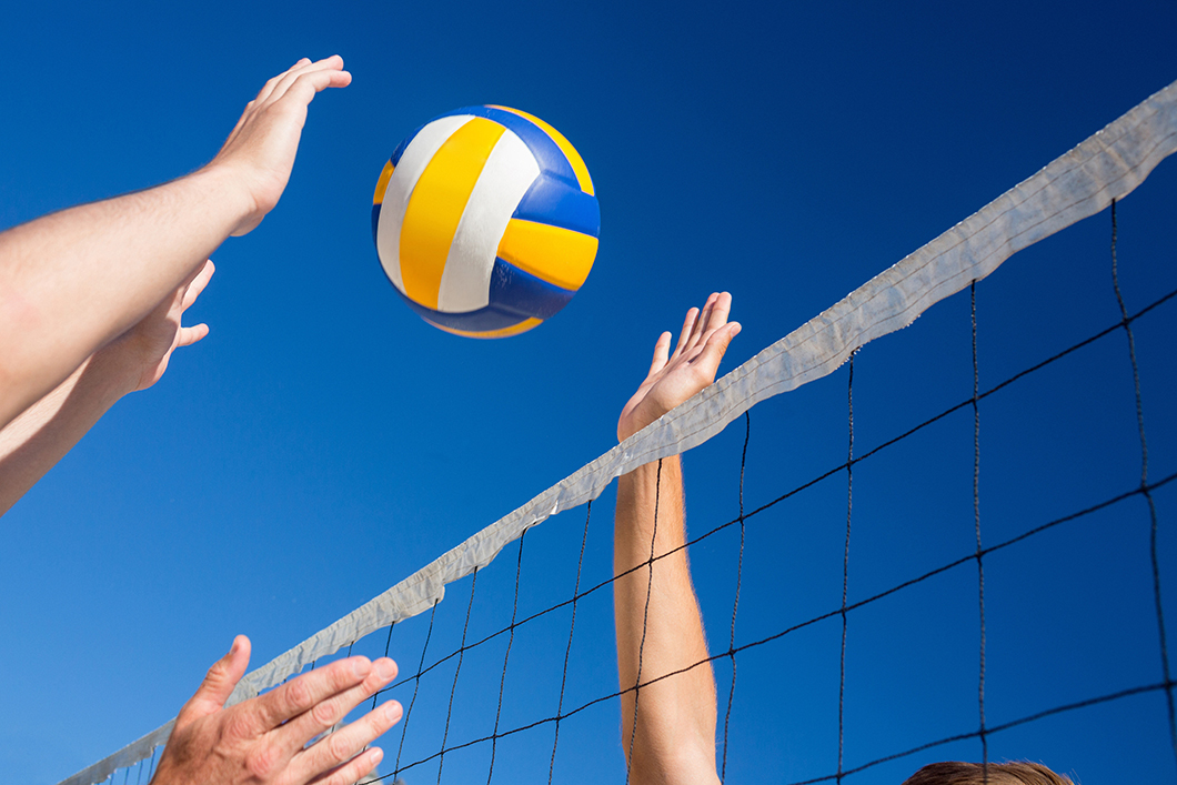 Friends playing volleyball